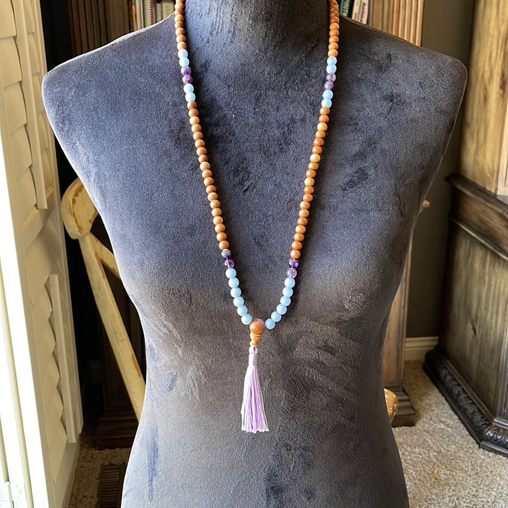 Necklace.  Wood/ plastic beads.   Thread tassel.
